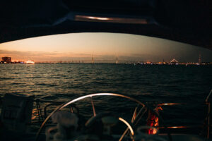 charleston skyline at sunset on a sailboat with blue life charters